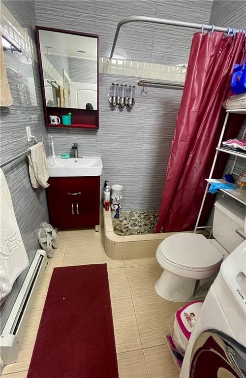 Luxurious bathroom with dual vanities and walk-in shower at 2536 E 1st St, Brooklyn, NY