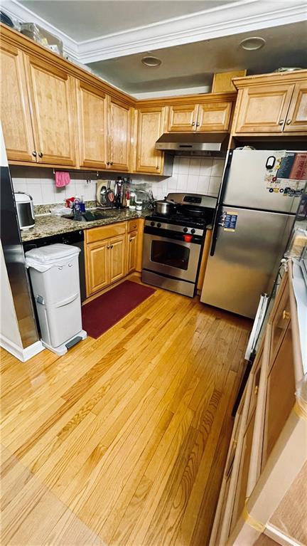 Modern kitchen with stainless steel appliances and granite countertops at 2536 E 1st St, Brooklyn, NY