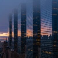 NYC luxury high-rise buildings at dusk representing luxury real estate market uncertainty